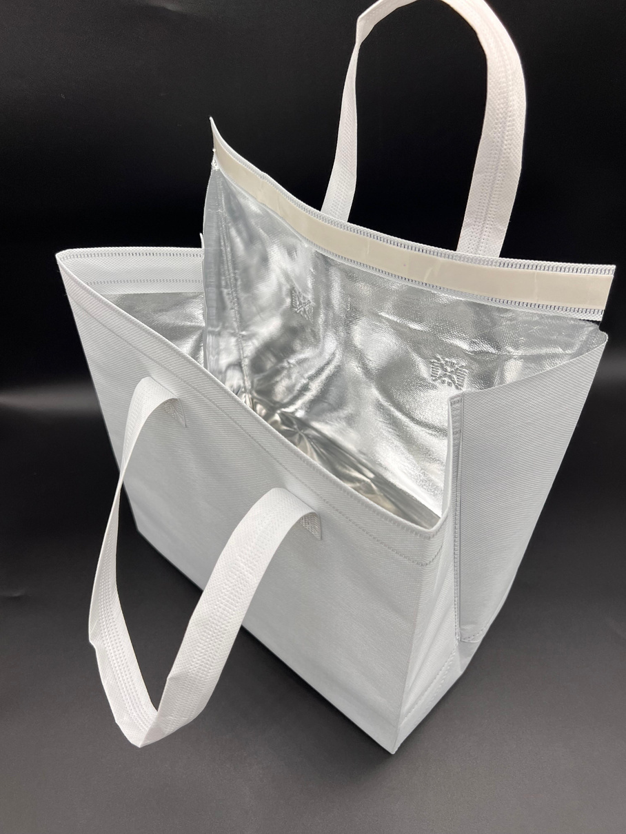 Sac isotherme bébévert blanc avec contenants de repas pour restaurant